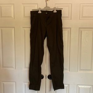 Dark green men’s size 34 Lulu lemon dry fit dress pants with zipper pockets.